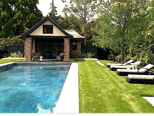 Large trendy backyard stone and custom-shaped natural pool house photo